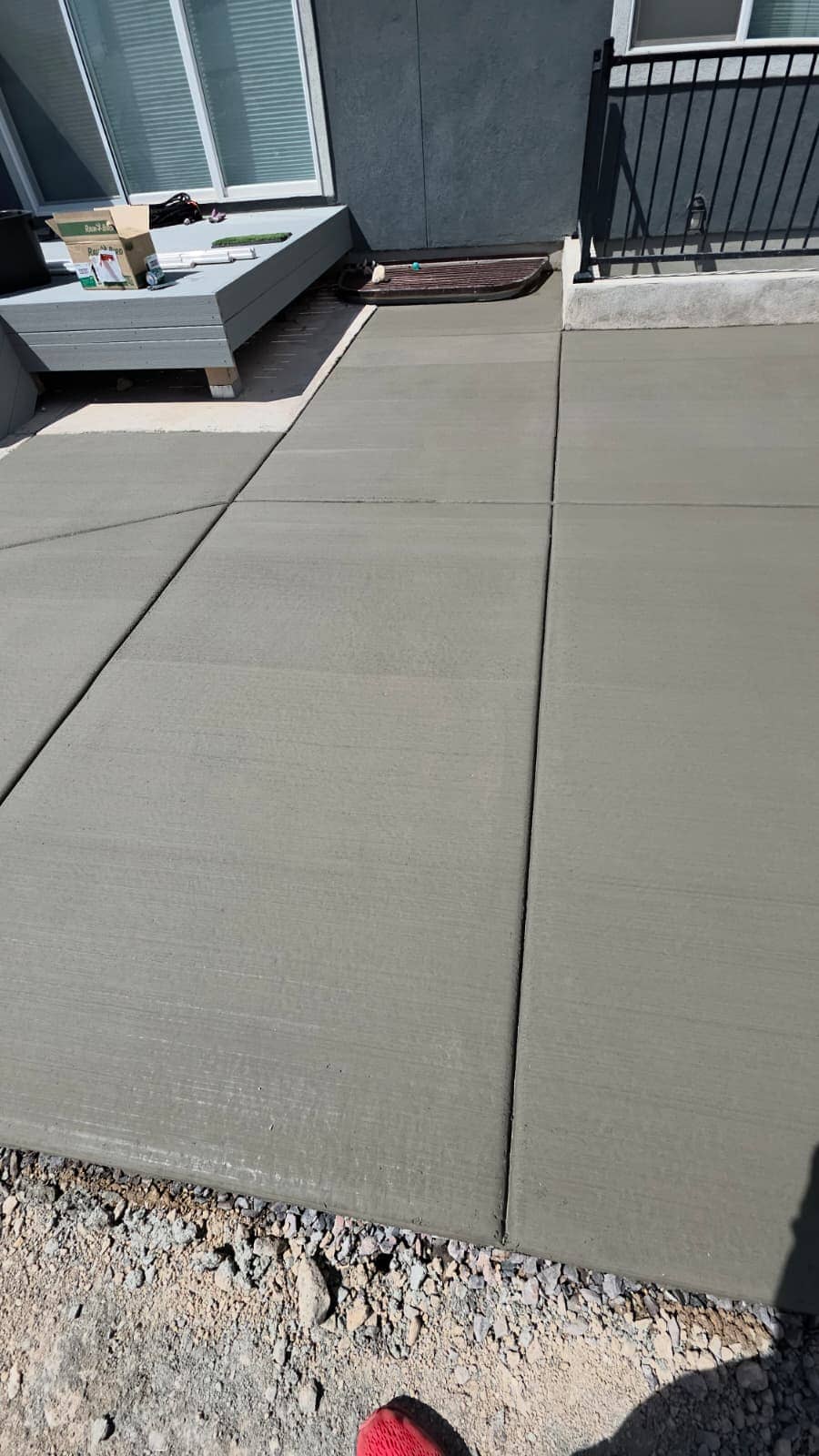 Wide finished concrete driveway with control joints cut on a regular grid